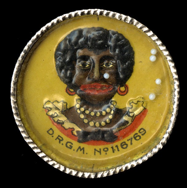 “Head of a Black Woman” Embossed Dexterity Puzzle with Advertising Back, c. 1905