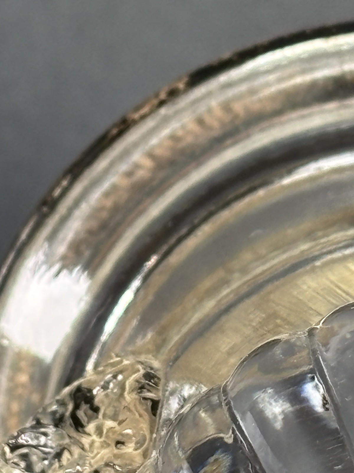 F.B Roger pressed glass toothpick holder with a silver rim and molded lion heads