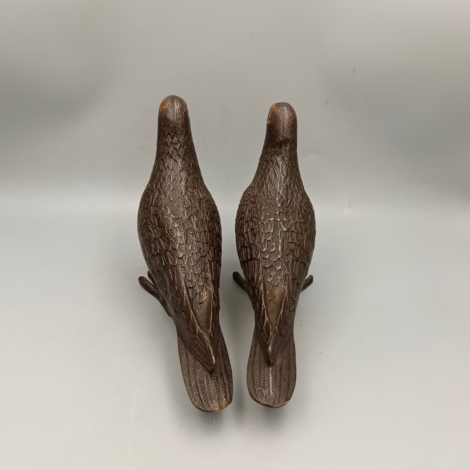 A pair of red copper gilded peace doves