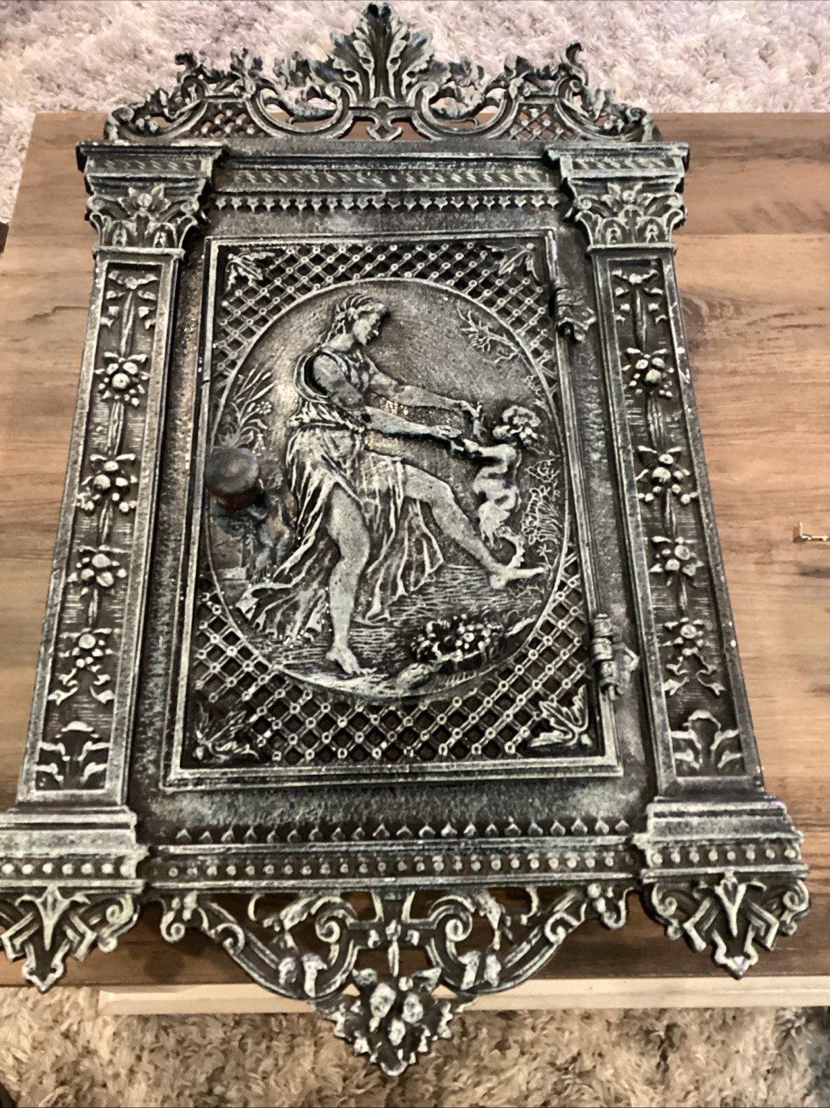 Antique cast iron fireplace door repurposed into wall mounted safe/jewelry box