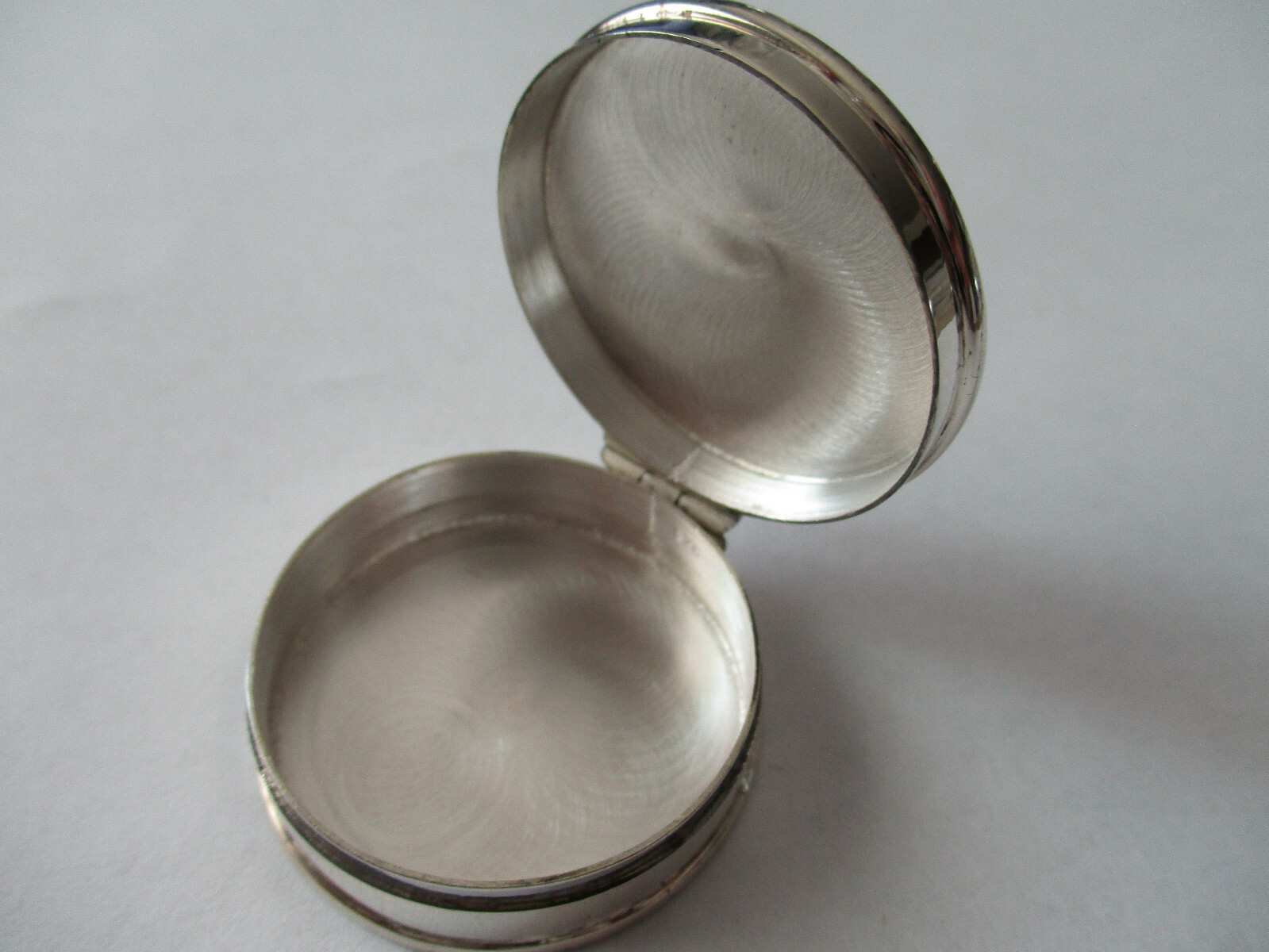 Sterling silver pill box round shape engraved on top and hallmarked