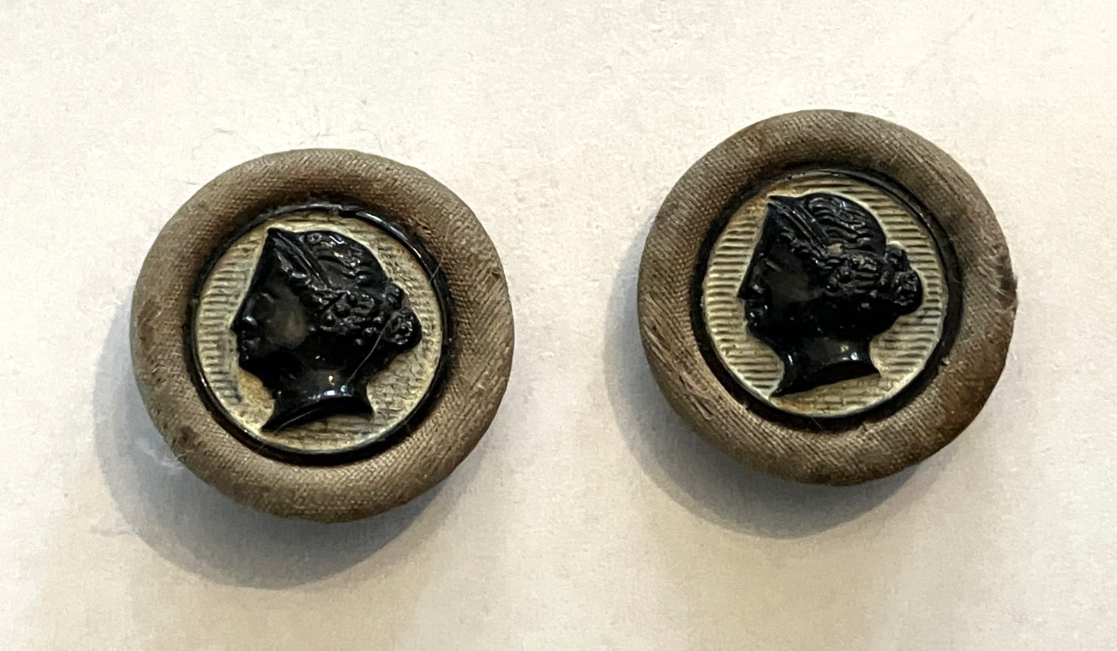 2 Victorian Black Glass Cameo with Cloth Wrapped Frame & Pad Back Buttons