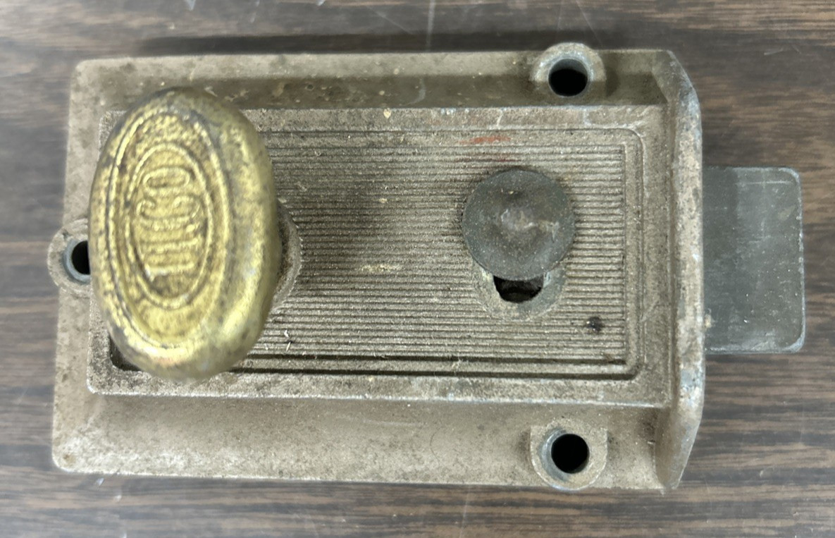 Vintage ILCO spring loaded lockable deadbolt lock with brassy turn knob