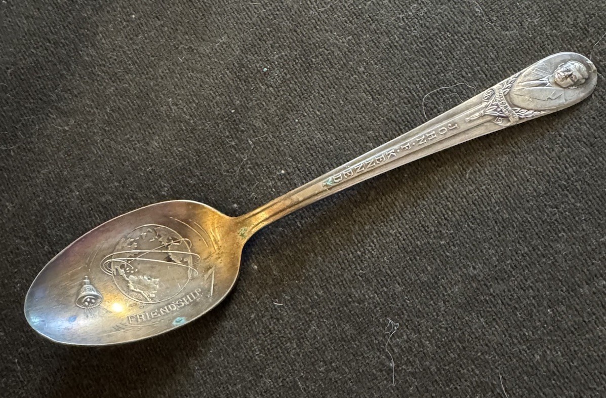 A silver-plated souvenir spoon commemorating John F. Kennedy and Friendship 7.