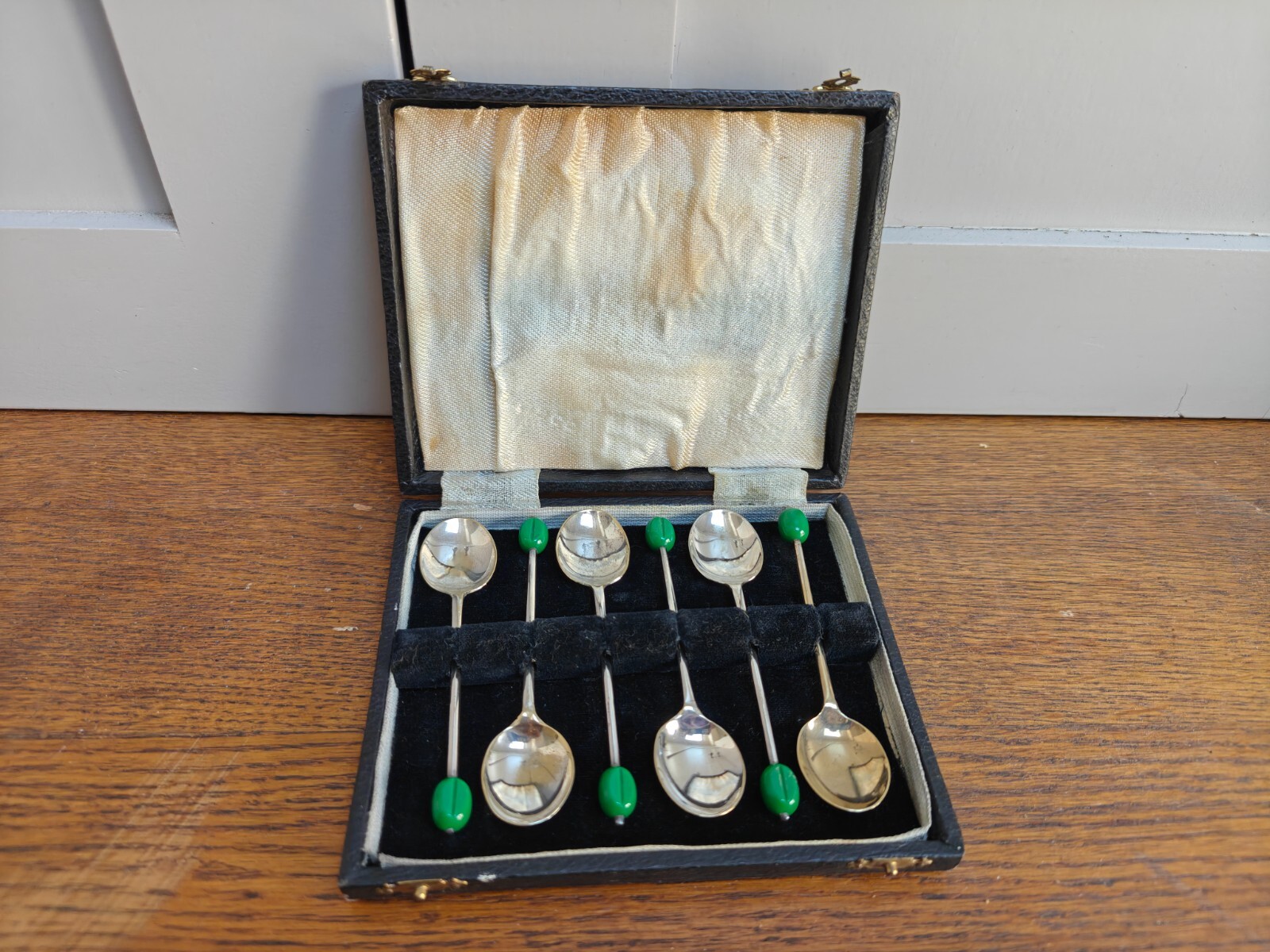 6 EPNS coffee spoons with green ‘bean’ handles