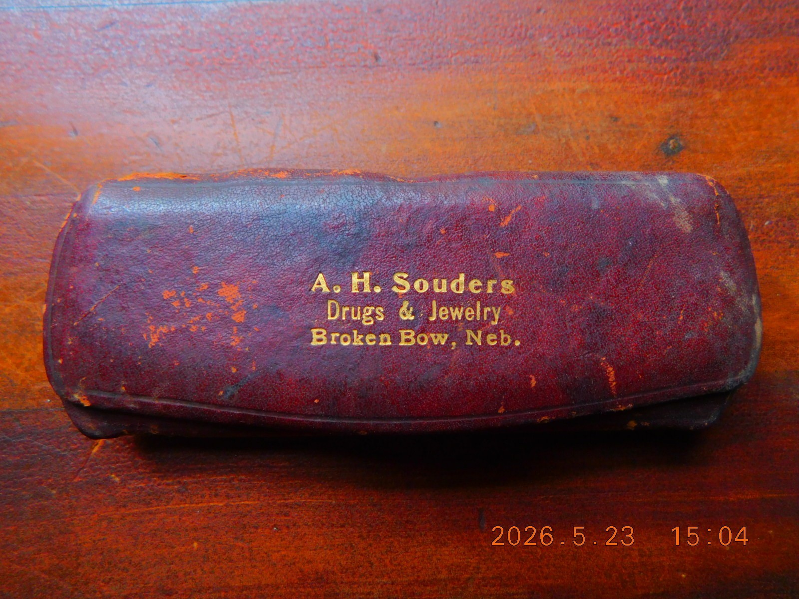 C. early 1900’s leather spectacles case from A.H.Souders store, Broken Bow. Nebr