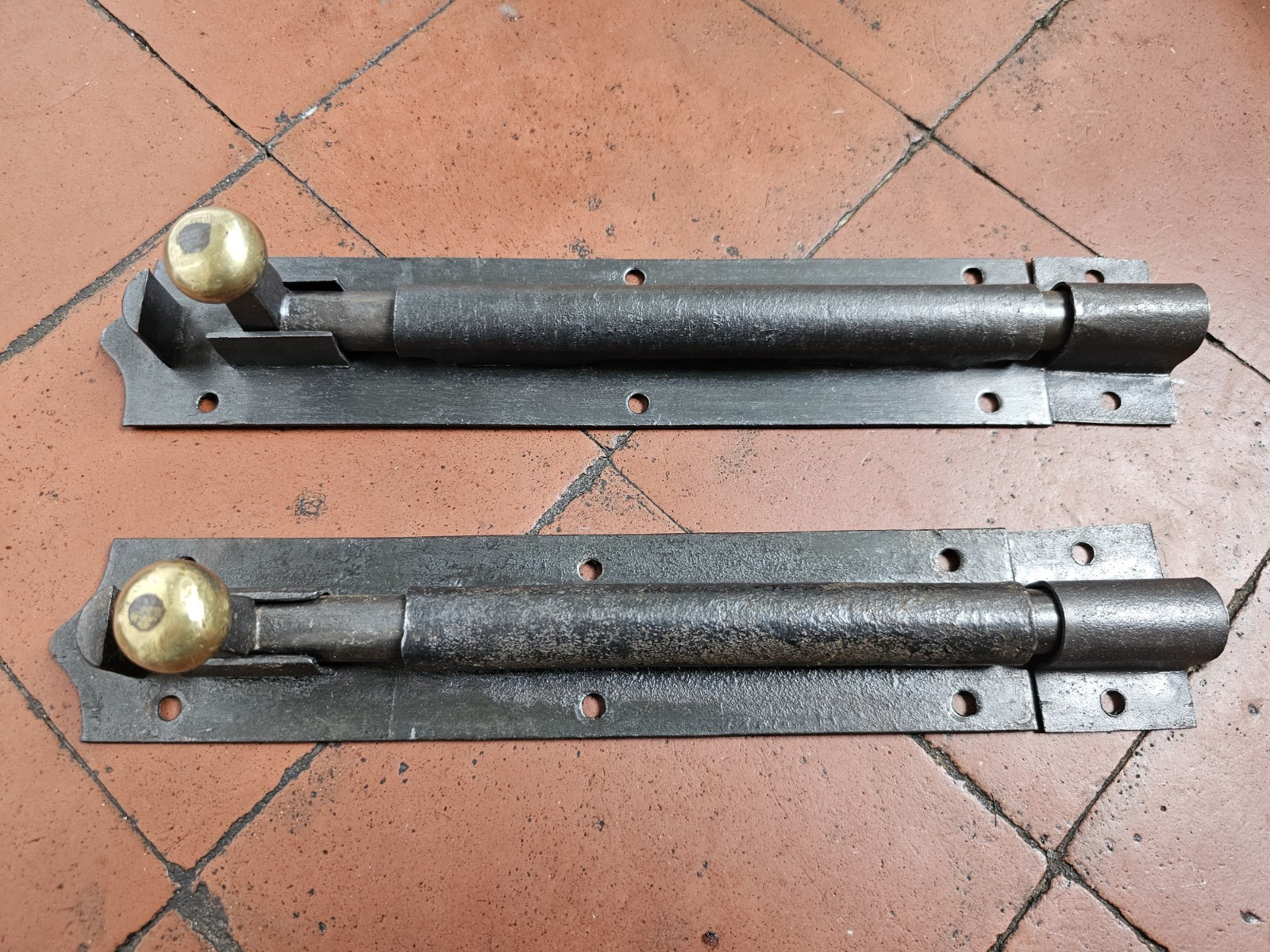 Antique Victorian black iron and brass door bolt with surface mounted keep 1880