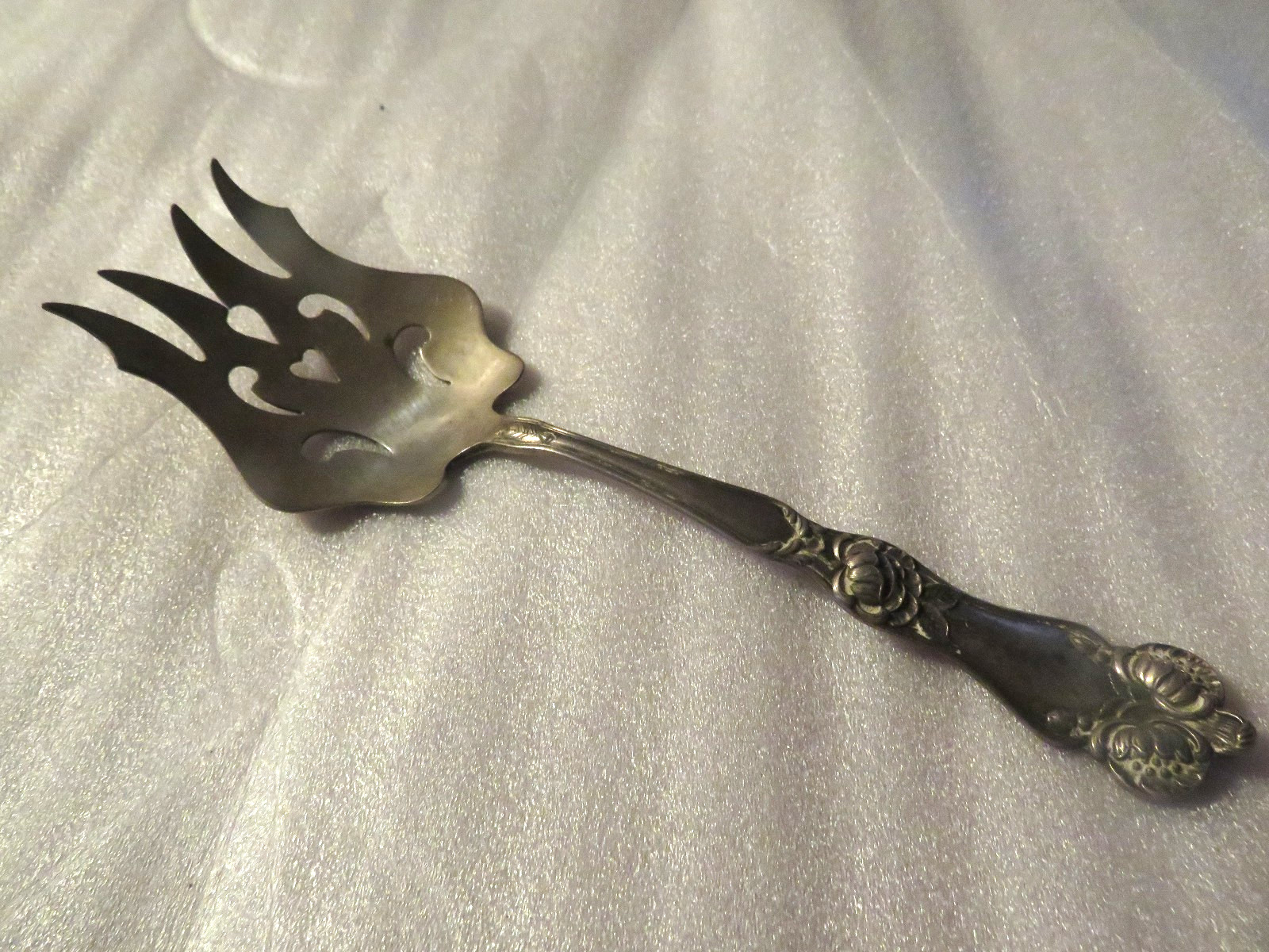 VTG MEAT FORK MARKED STERLING WITH 2 EAGLES & M~EMBOSSED FLOWERS ON THE HANDLE