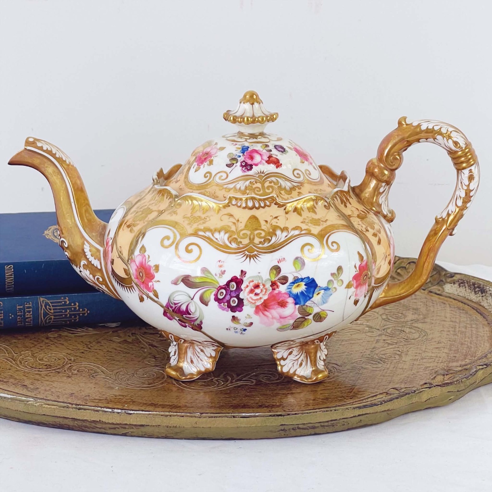 A Kintsugi repaired H & R Daniel Shrewsbury teapot, handpainted flowers c.1830