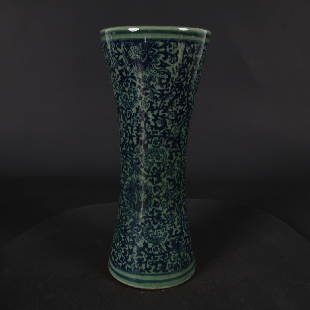 Green glazed blue and white entwined floral arrangement