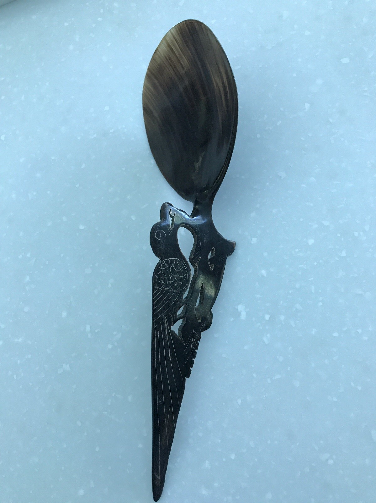 buffalo horn carved spoon, 10 1/2 inches by 3 1/4 inches bird motif.