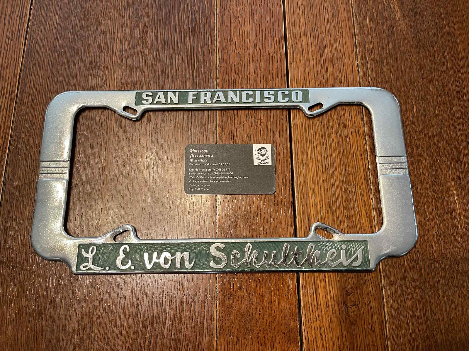 vintage license plate frame L. E. Schultheis San Francisco Packard / Studebaker