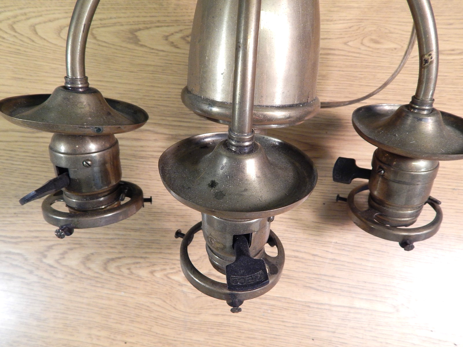 EARLY ANTIQUE SOLID BRASS TRIPLE SOCKET WALL SCONCE, DATED 1890.