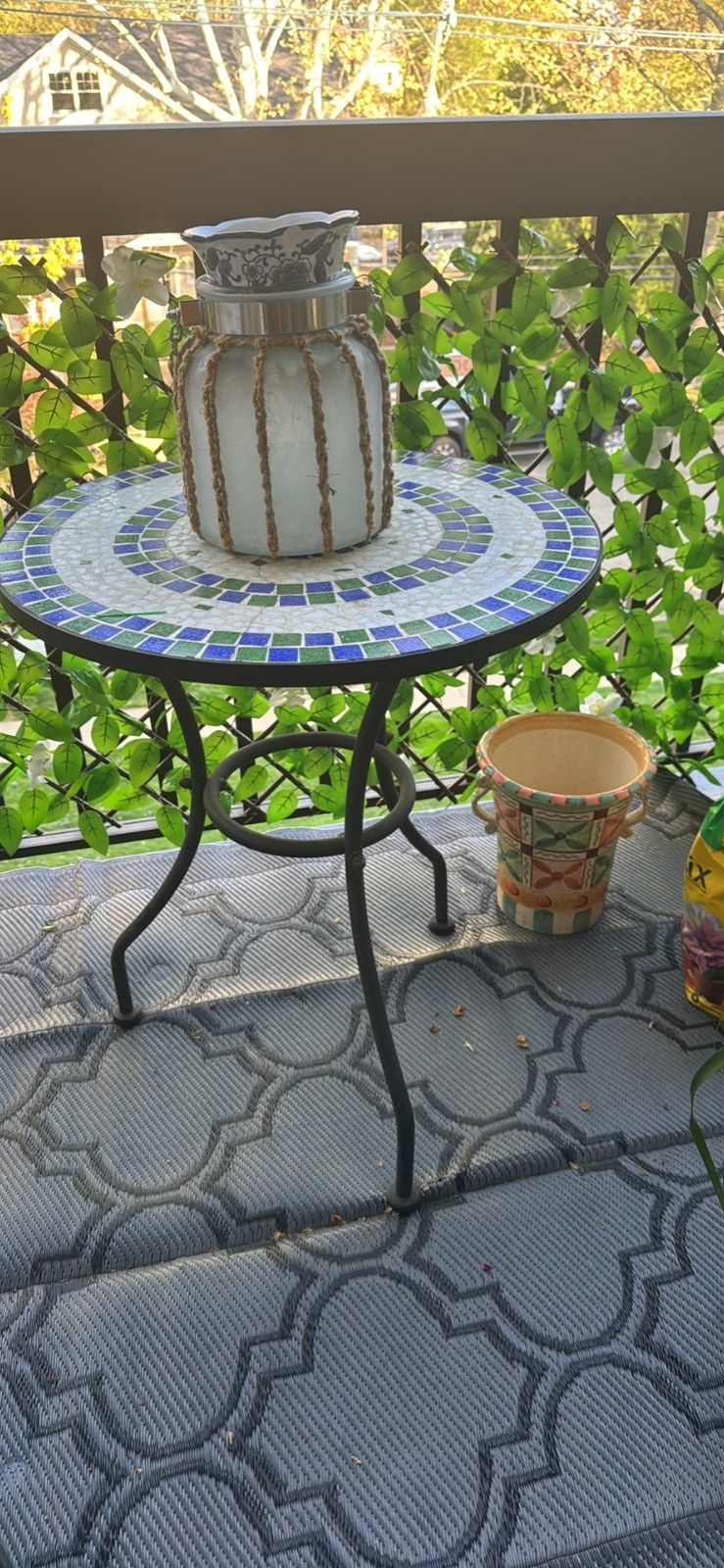 Small cast iron table. Top color are blue, green and white.