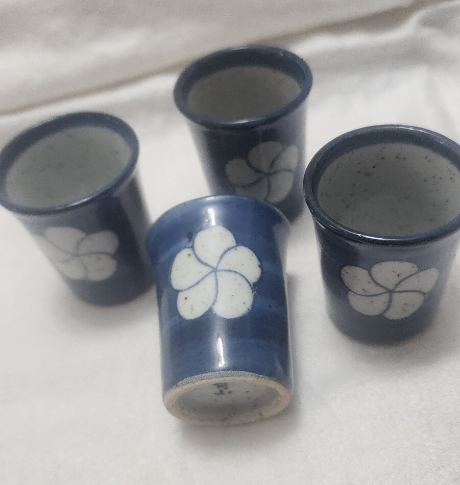 Vtg Sake cups Stoneware Guinomi 4 cups Blue with white flower stamped on bottom