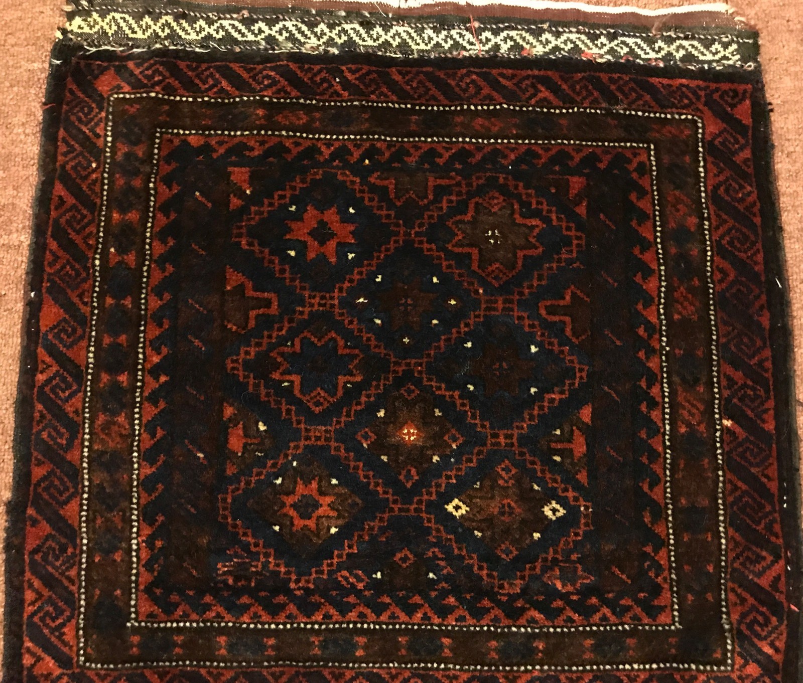 AN ANTIQUE REAR BALUCHSTAN TRIBAL BAG FACE