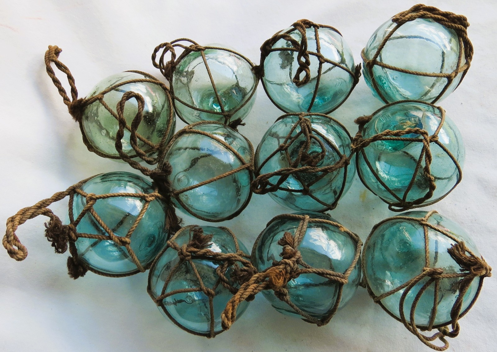 “Twisted Sisters” (11) Japanese Blown Glass Fishing Floats 2″ Netted Handles Vtg