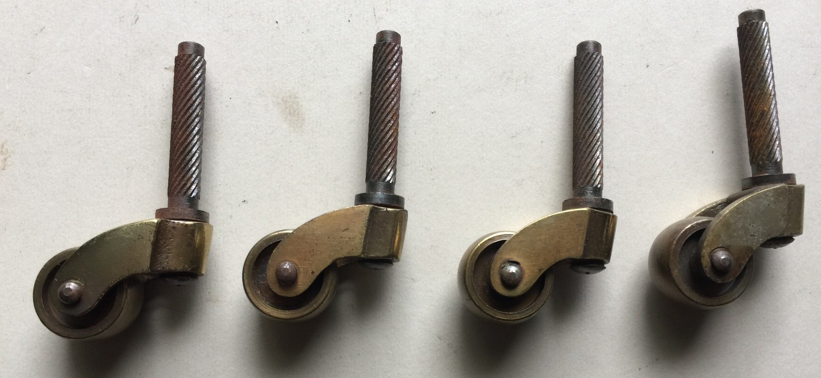 Vintage Set of 4 Steel Furniture Casters Brass Grip Ring Stem Antique Wheels