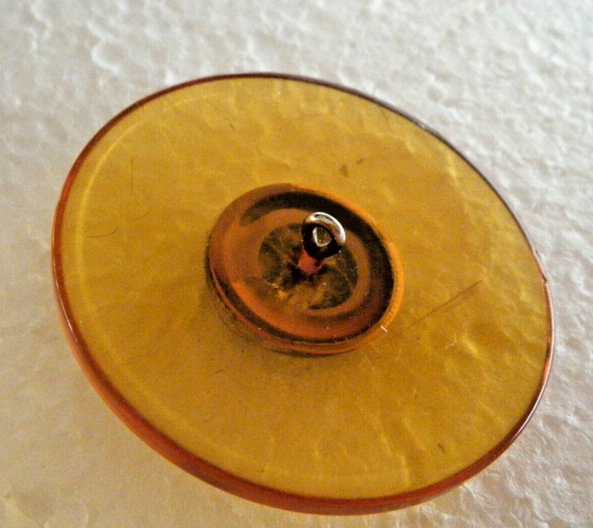 Vtg picture button Apple Juice Bakelite amber color w brass button warrior 2″