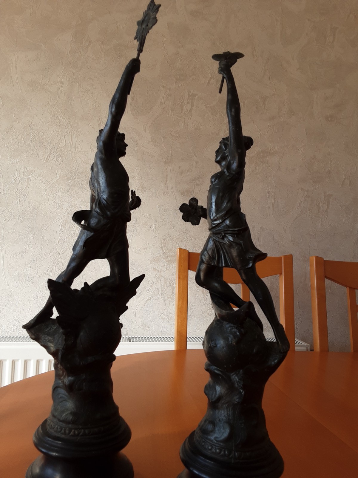 A pair of antique French cast spelter statuettes, “Le Matin et Le Soir”