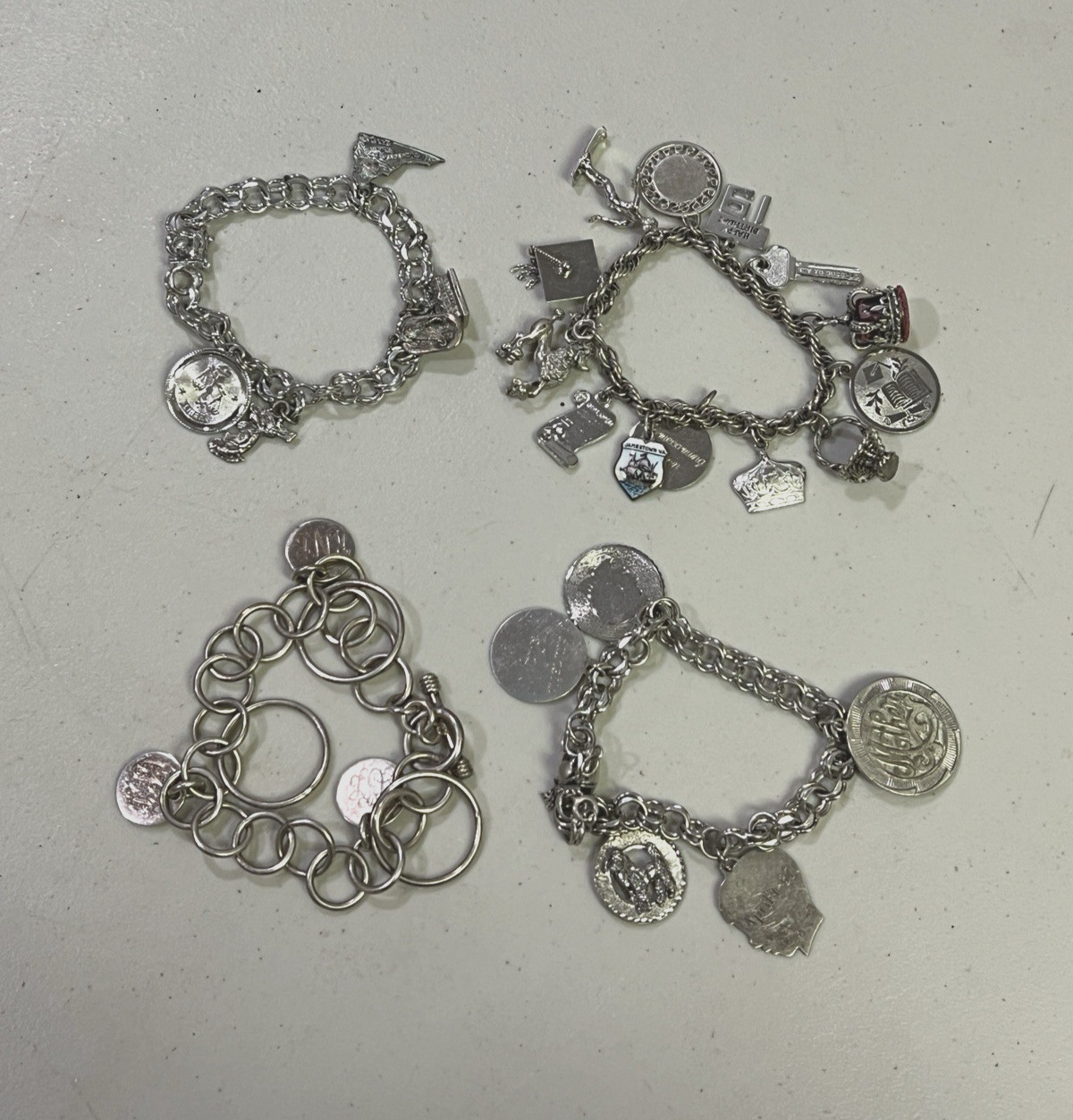 VINTAGE LOT OF 4 .925 STERLING SILVER CHARM BRACELETS W/ CHARMS 130 GRAMS