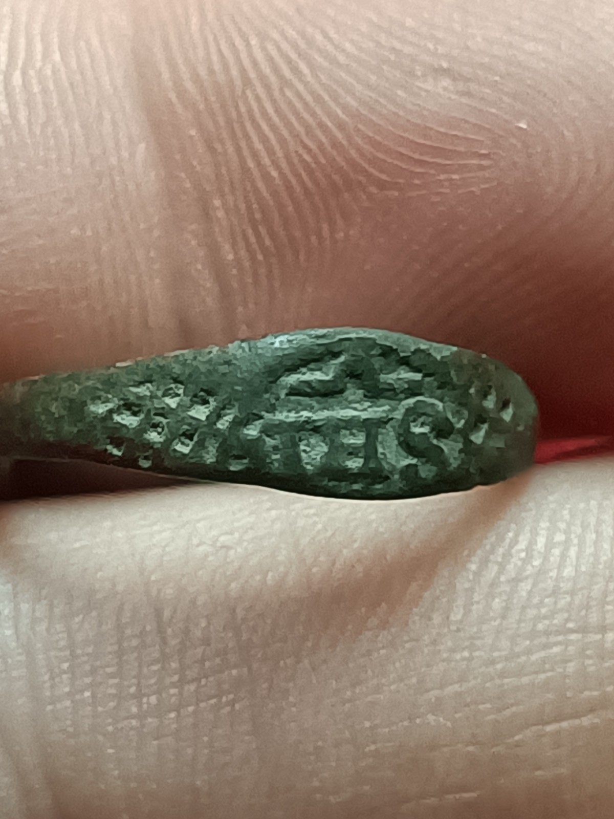 Antique bronze ring, Christian religious symbol. Engraved with the initials IHS