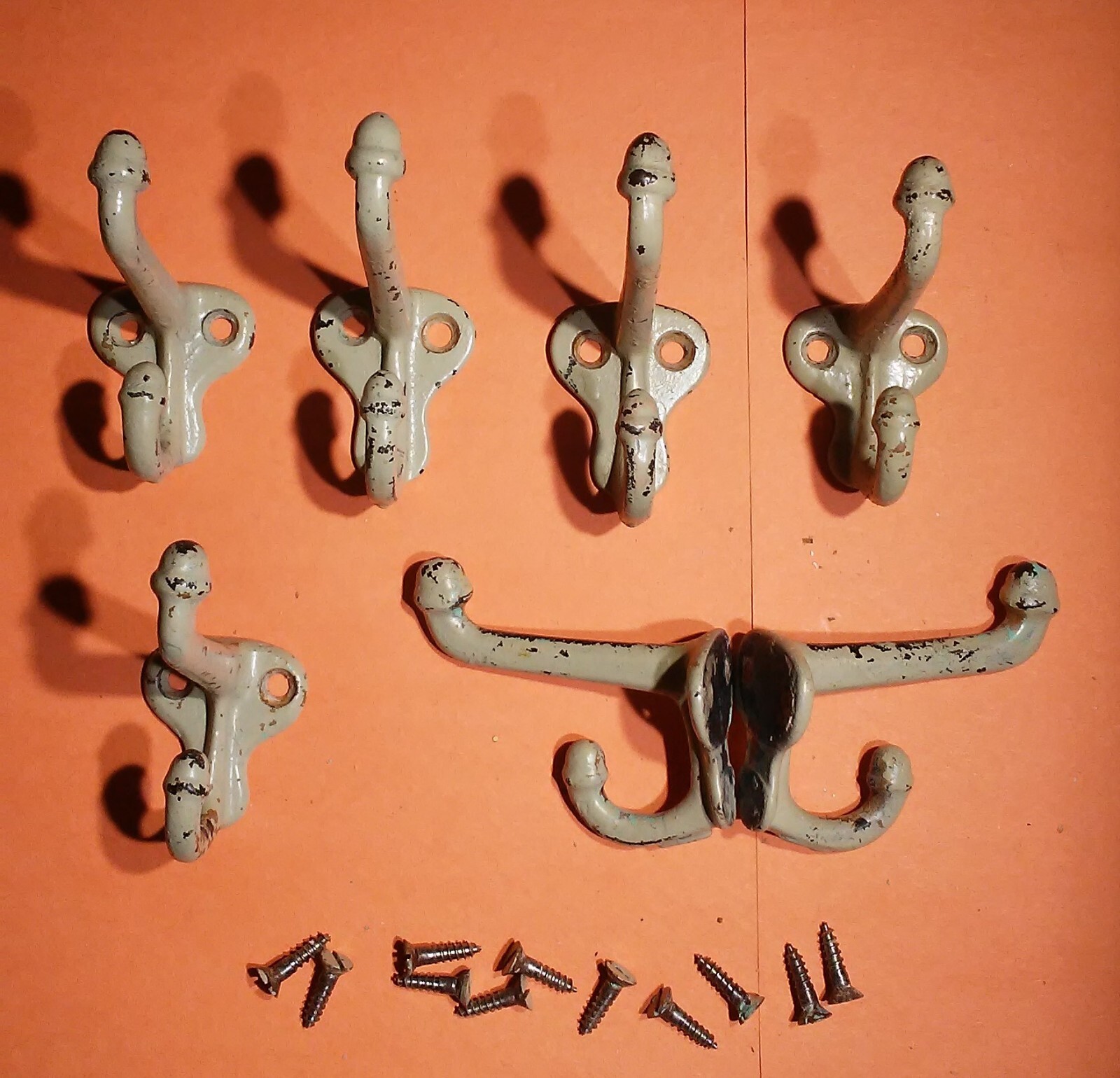 Vintage Painted Black Cast Iron coat hooks set of 7 with vintage screws