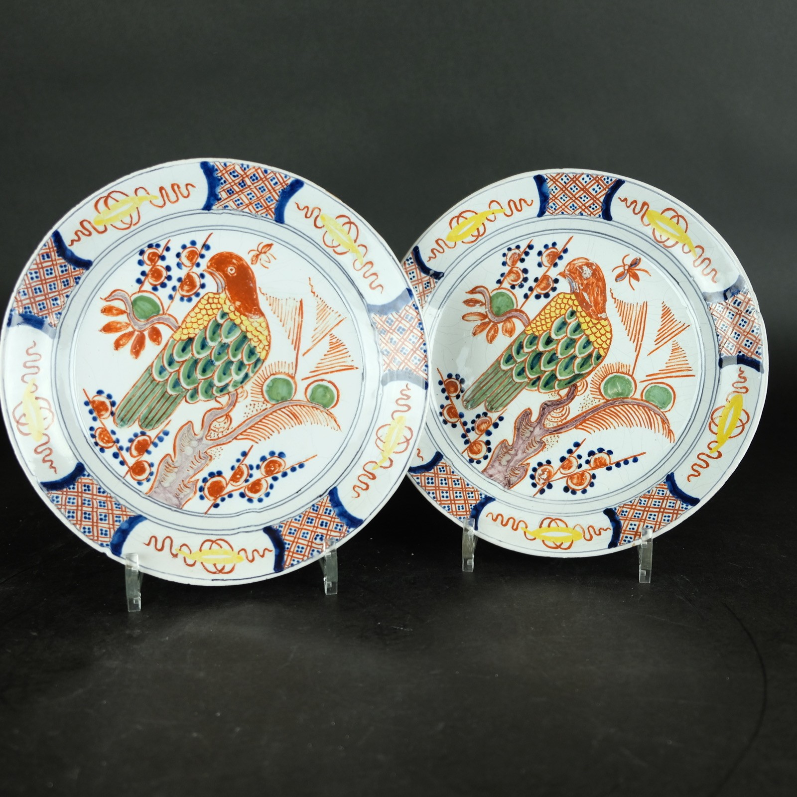 delft pancake plates with parrot or bird decoration 23cm polychrome 19th century