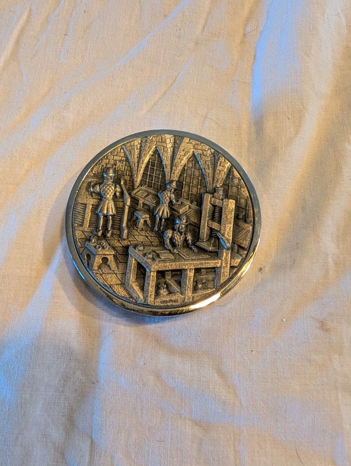Vintage Silver-Tone Round Paperweight with Workshop Relief