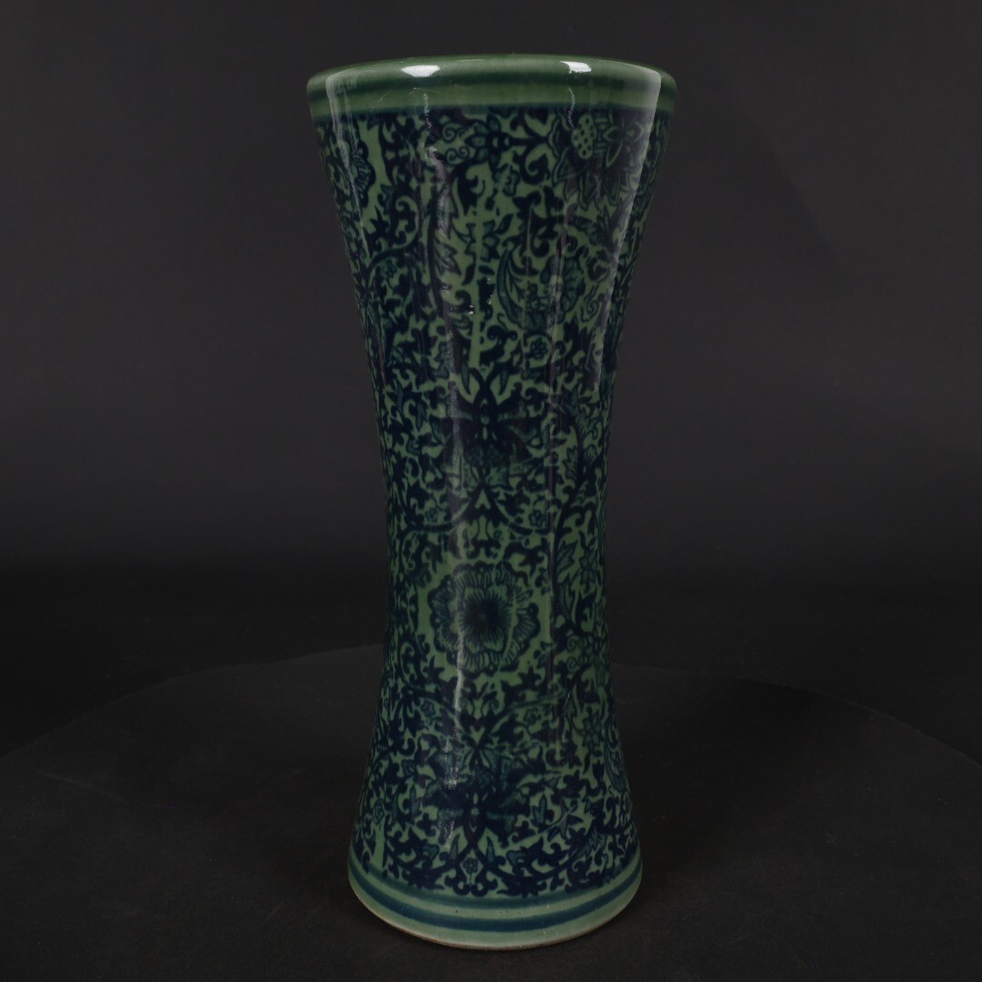 Green glazed blue and white entwined floral arrangement