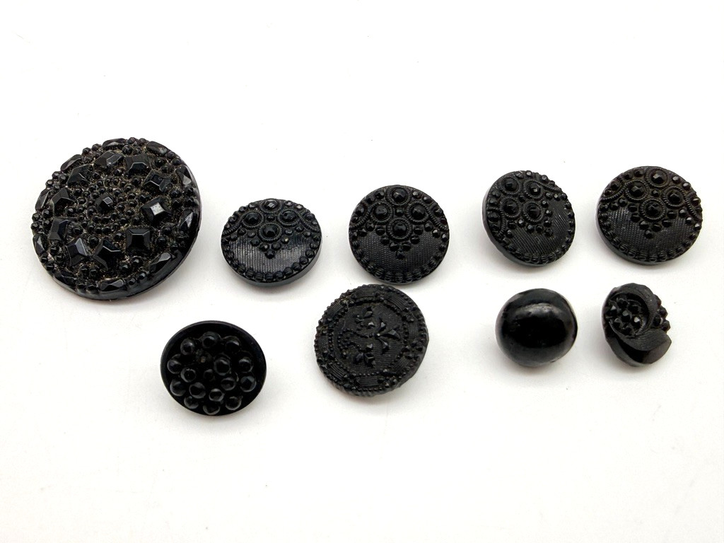 LOT: 9 Victorian Jet Black Pressed Faceted Glass Sew Through Self Shank Buttons