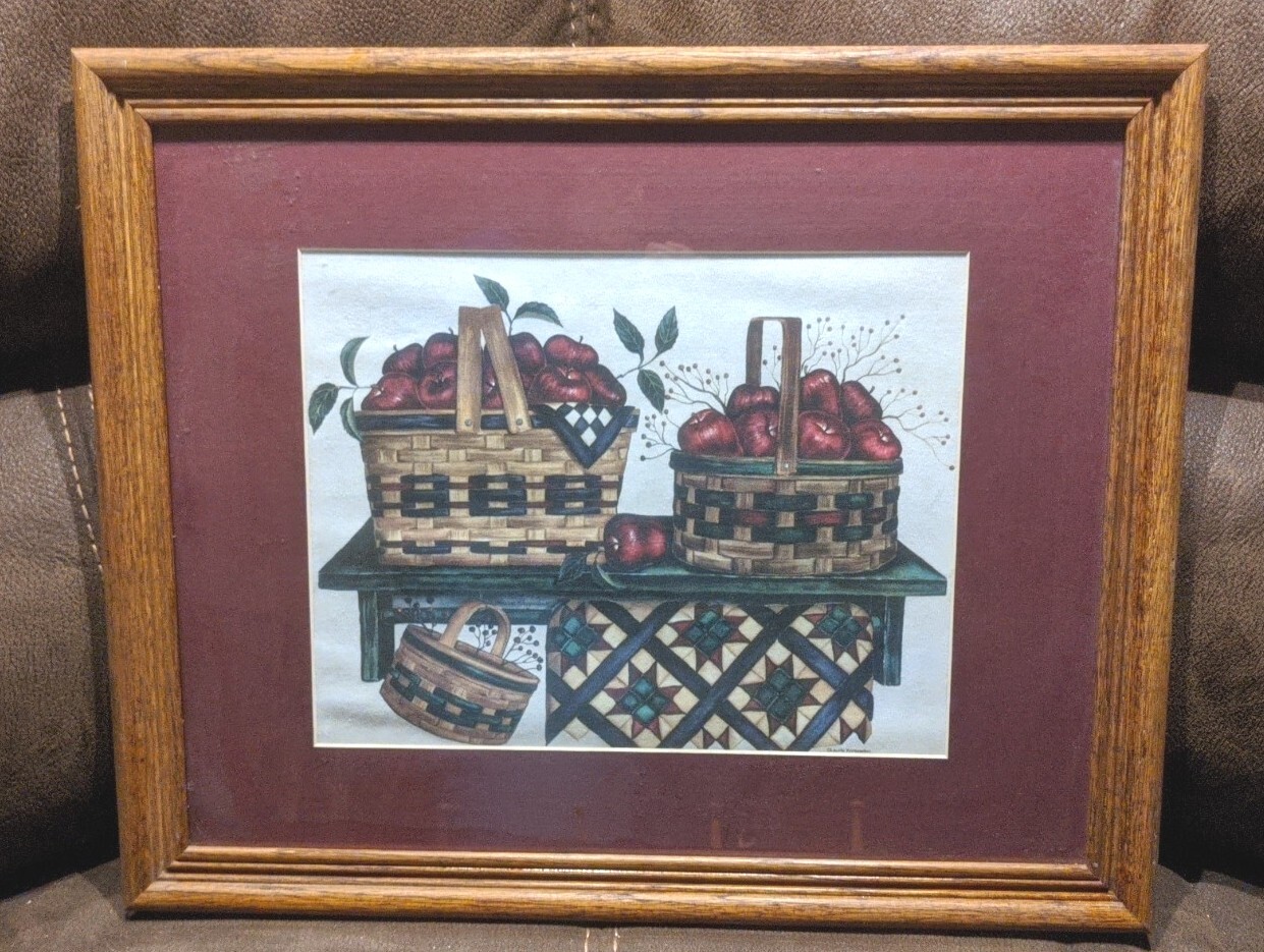 By Laurie Korsgadem baskets on shelf with apples and Quilt /