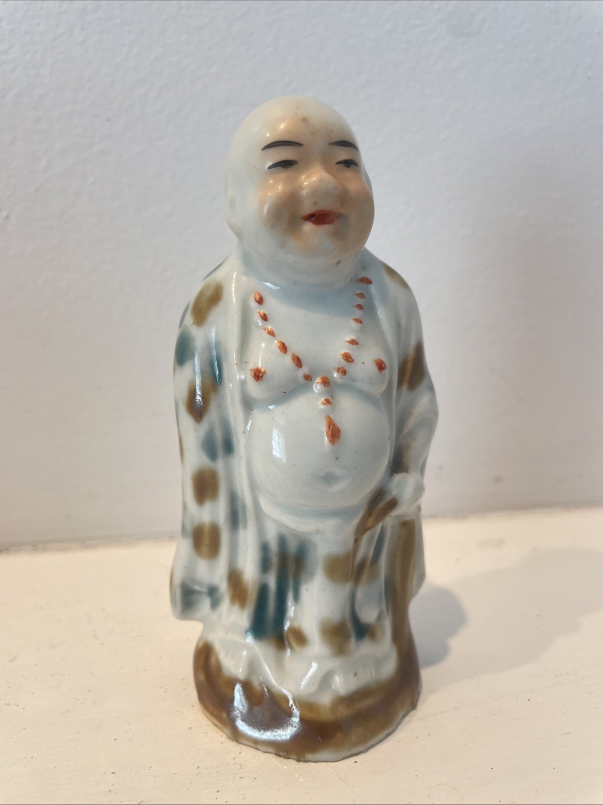 Antique porcelain Buddha mottled 20th century