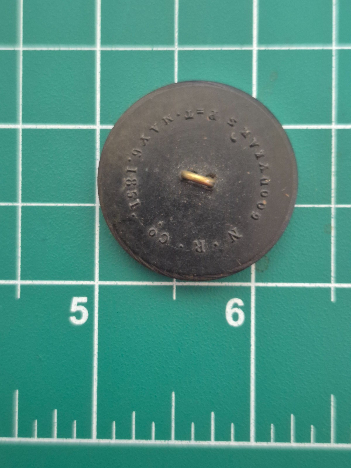 Antique 1851 Goodyear hard rubber button made by the Novelty Rubber Co. (N.R.Co)