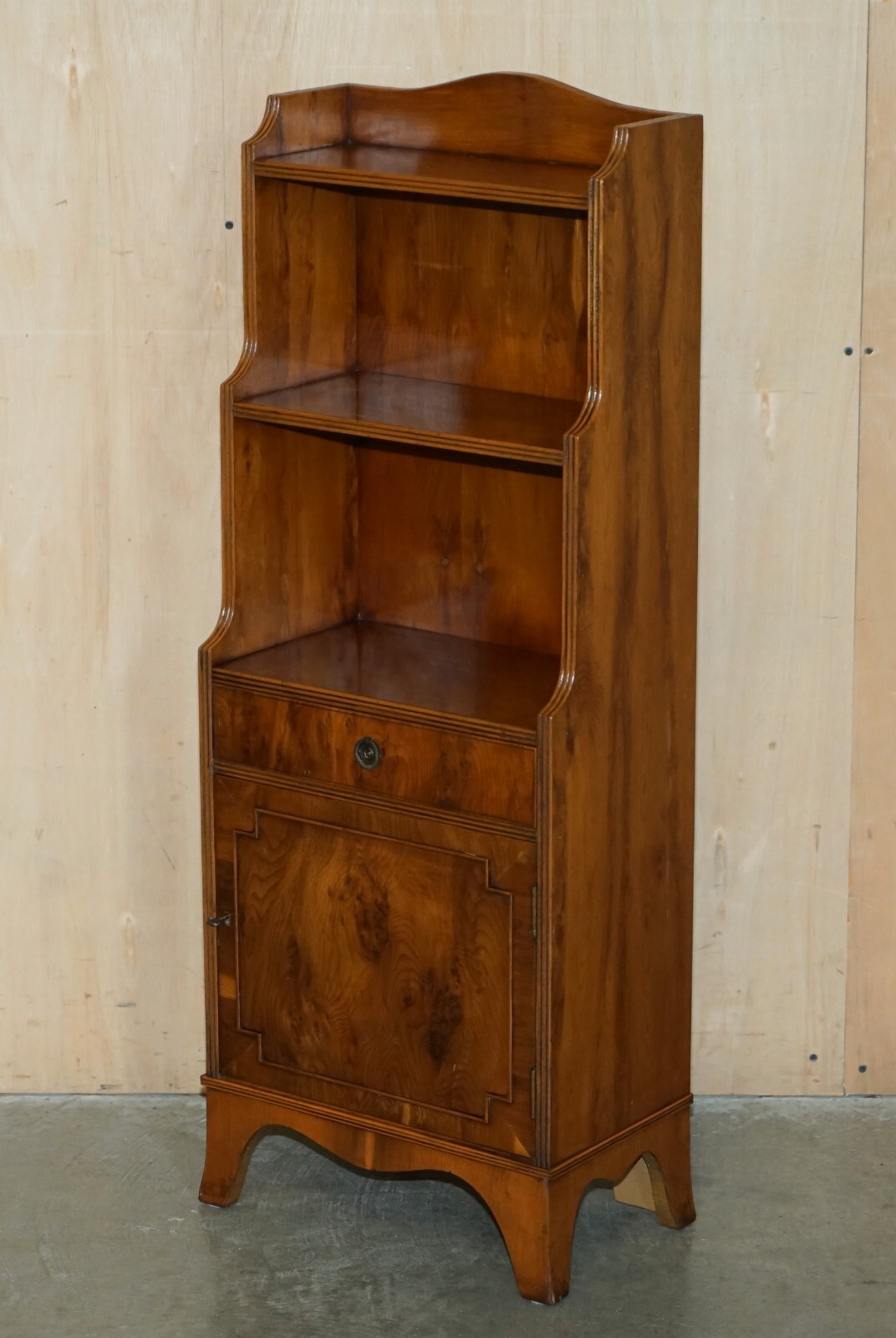 PAIR OF VINTAGE ENGLISH FLAMED MAHOGANY WATERFALL BOOKCASES WITH CUPBOARD BASES