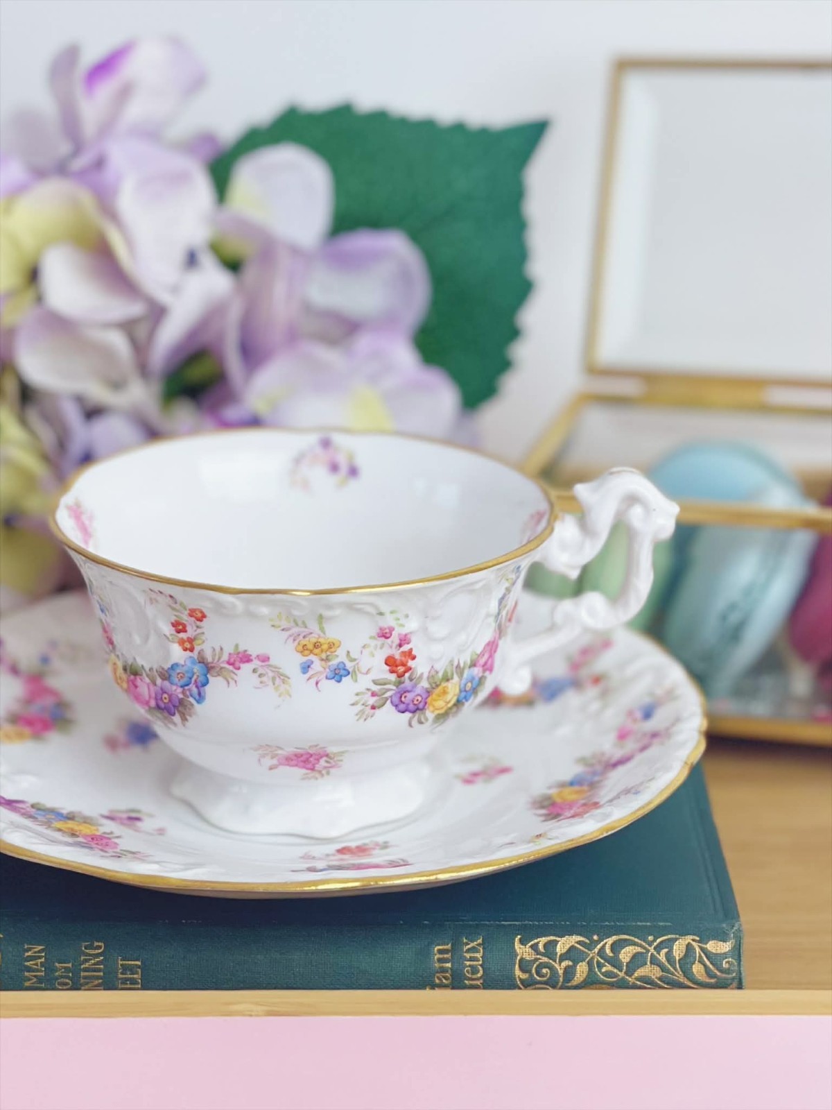 Antique Copelands China teacup duo, ornately moulded with handpainted flowers
