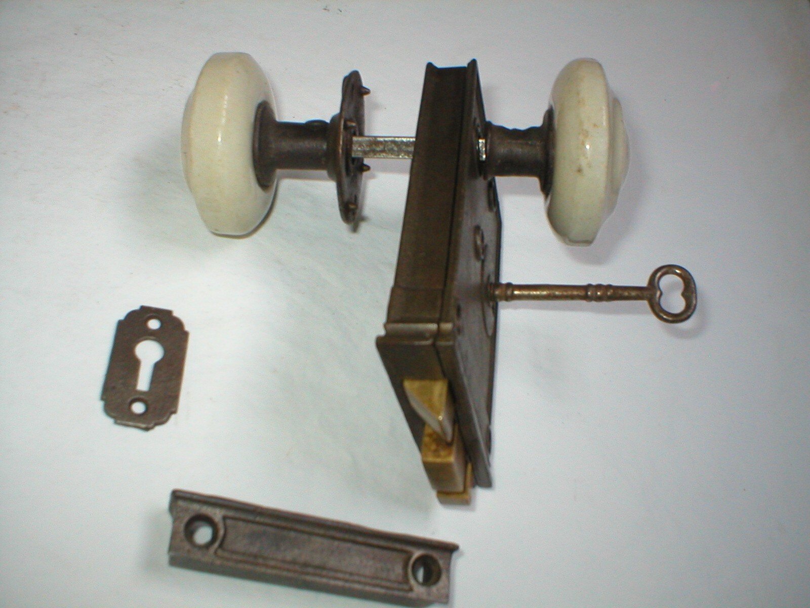 Antique Surface Mount Door Hardware with interesting Milk Glass Doorknobs