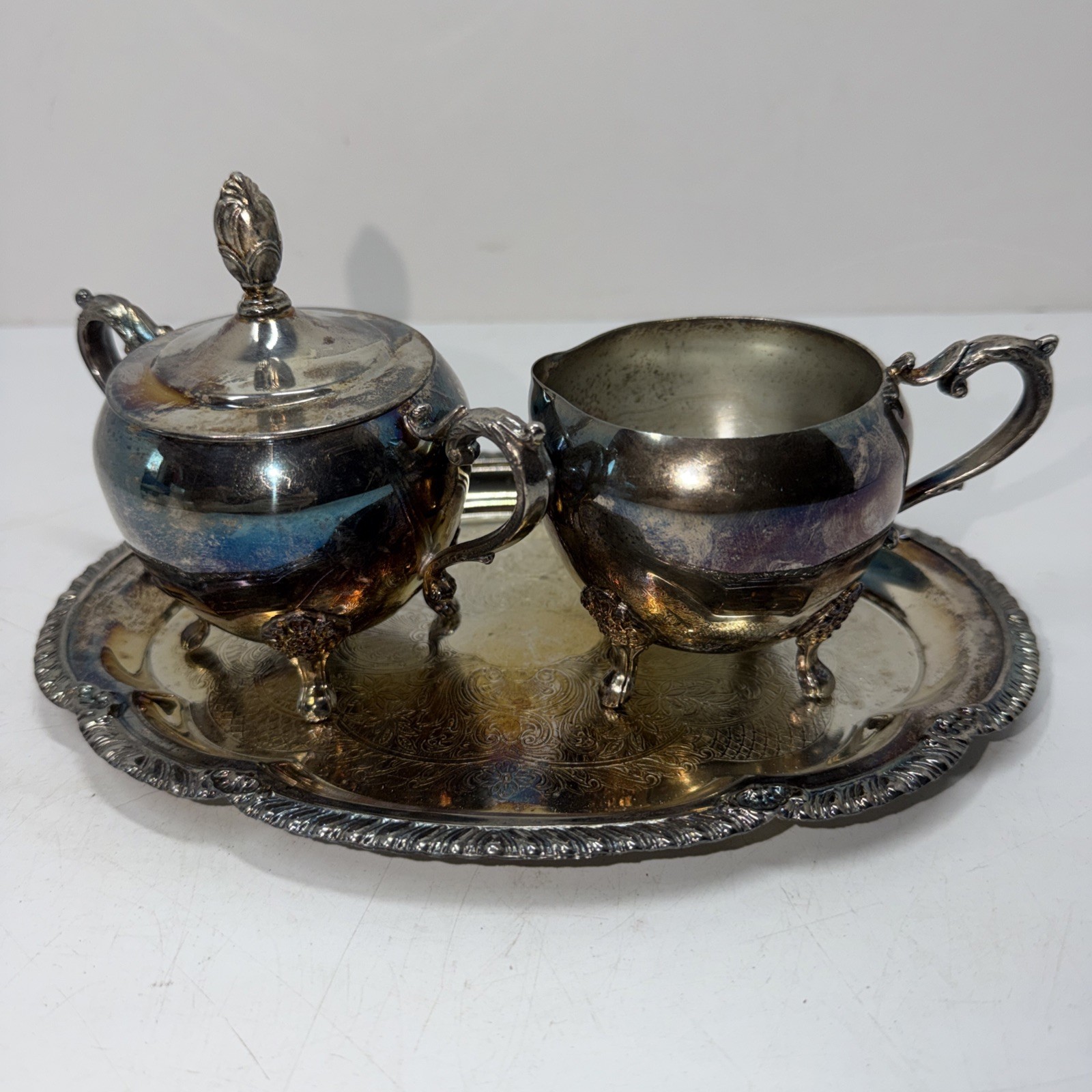 Vintage silver-plated creamer and sugar bowl set with matching tray