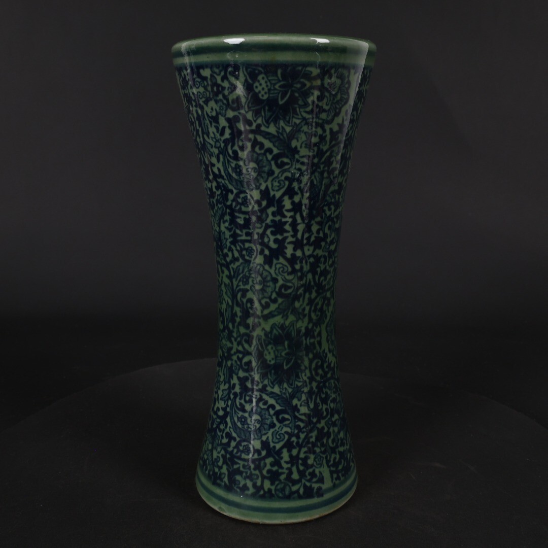 Green glazed blue and white entwined floral arrangement