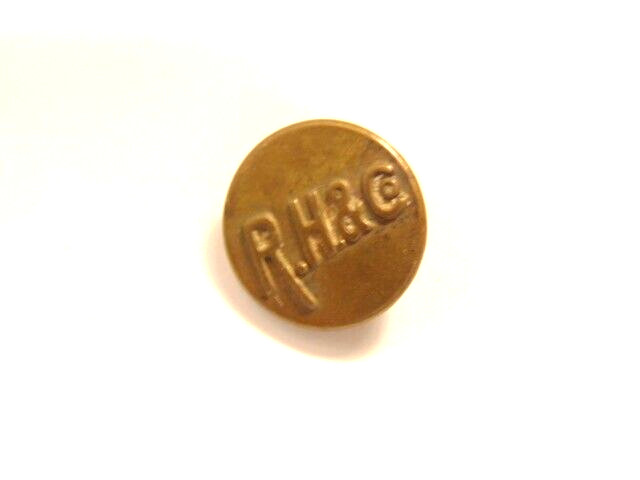 older brass colored “R.H. & Co.” button with 1913 and 1918 patent date on back