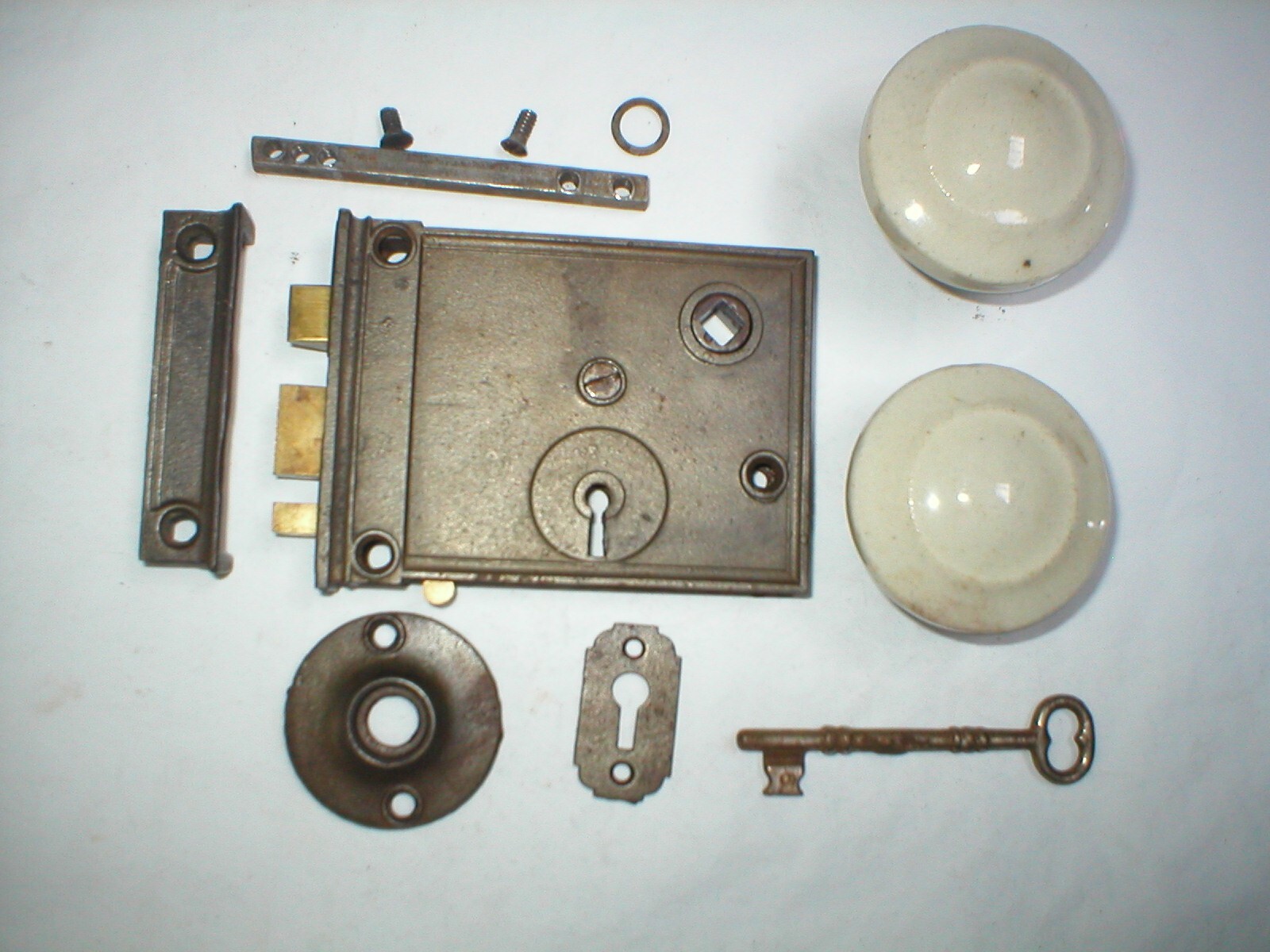 Antique Surface Mount Door Hardware with interesting Milk Glass Doorknobs