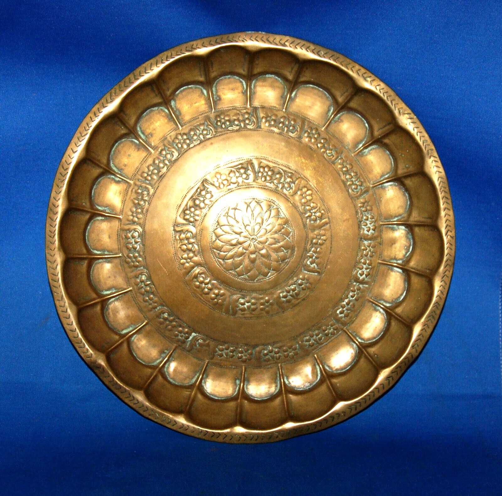 A lovely antique large dish, repousse floral centre, scallops