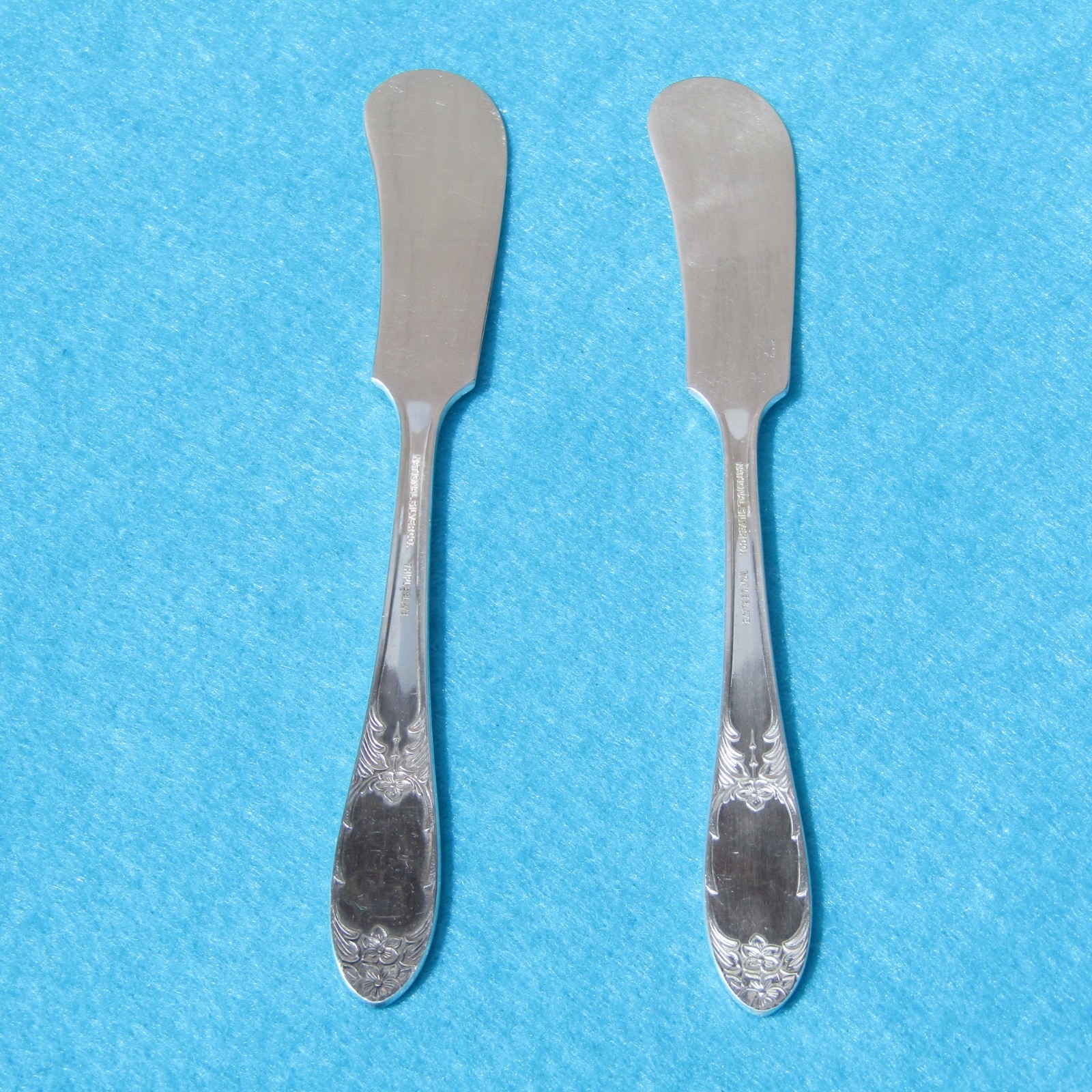 National Silver Co. Four Pattern Silver Plate (2) Flat Handle Butter Spreader