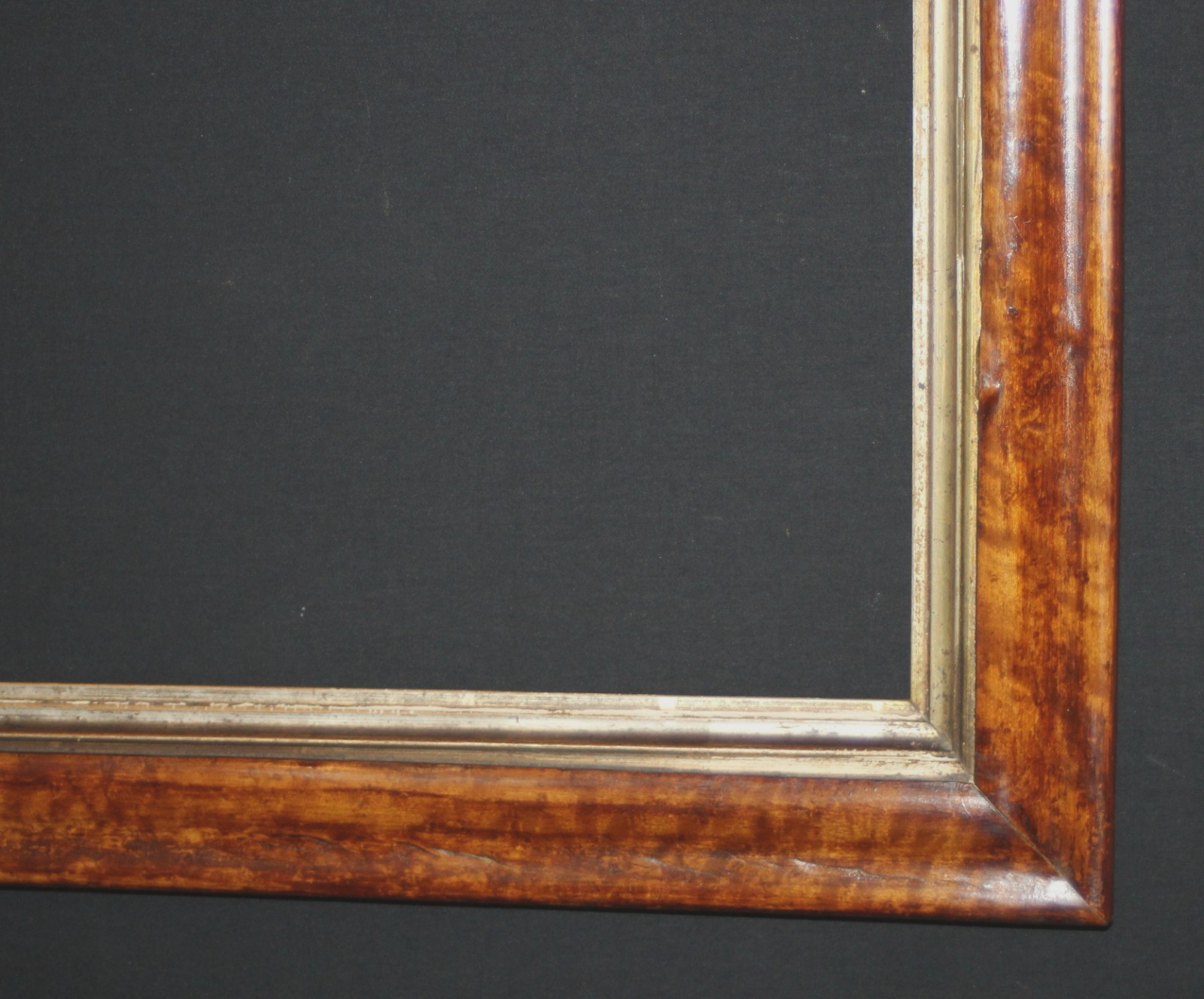 A Richly Patinated C19th Birds Eye Maple Frame. Sight Size: 23 1/4″ x 15 1/2″.