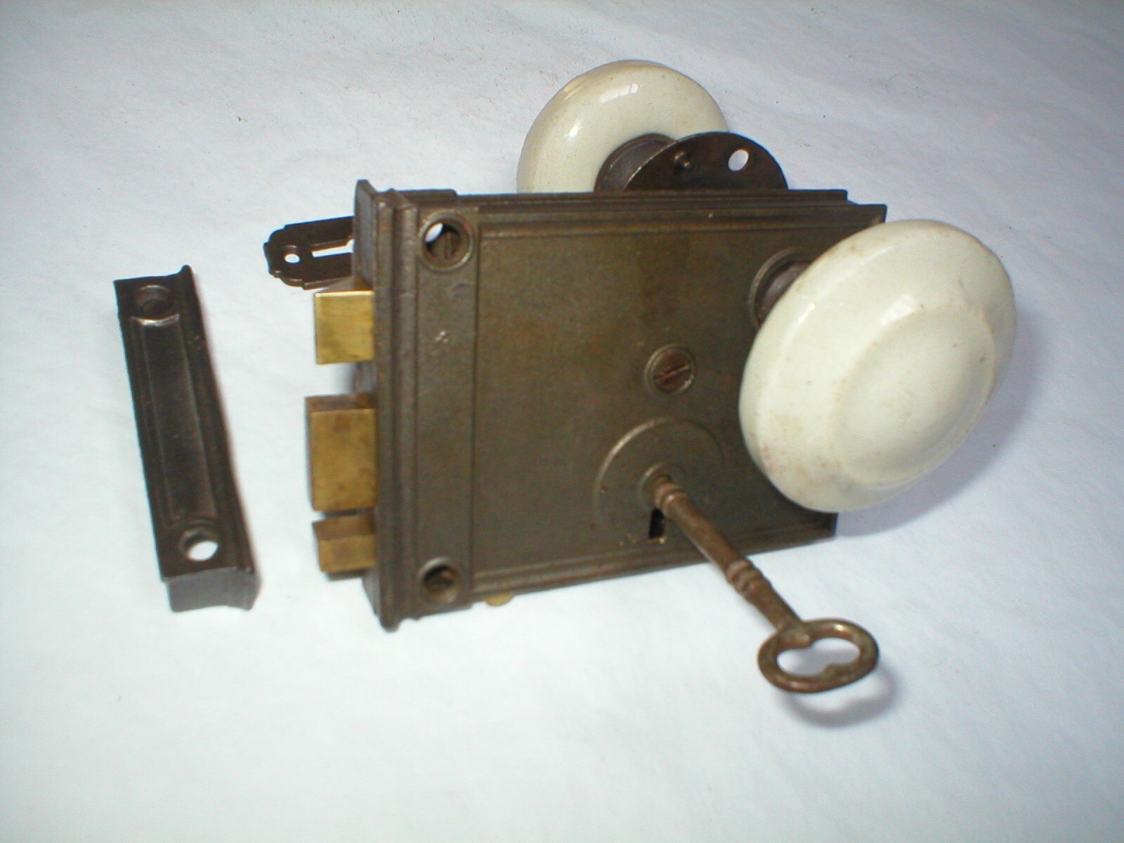Antique Surface Mount Door Hardware with interesting Milk Glass Doorknobs
