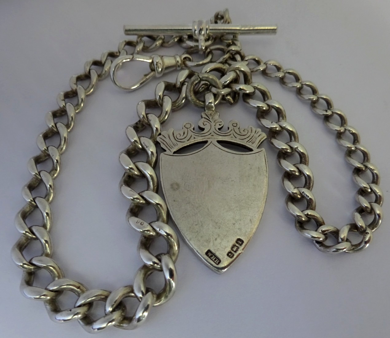 Antique solid silver pocket watch albert chain w/ silver & gold fob medal
