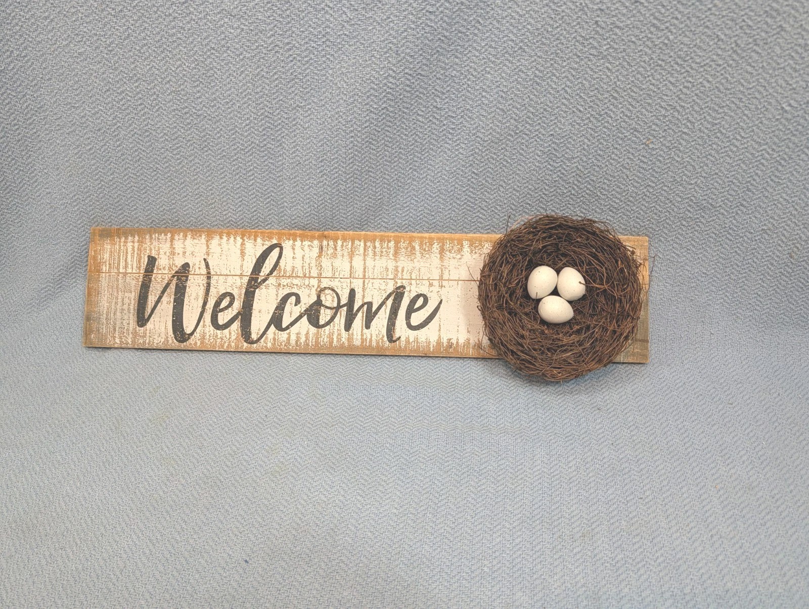 “WELCOME” Wood sign with bird nest and eggs 24″ wide