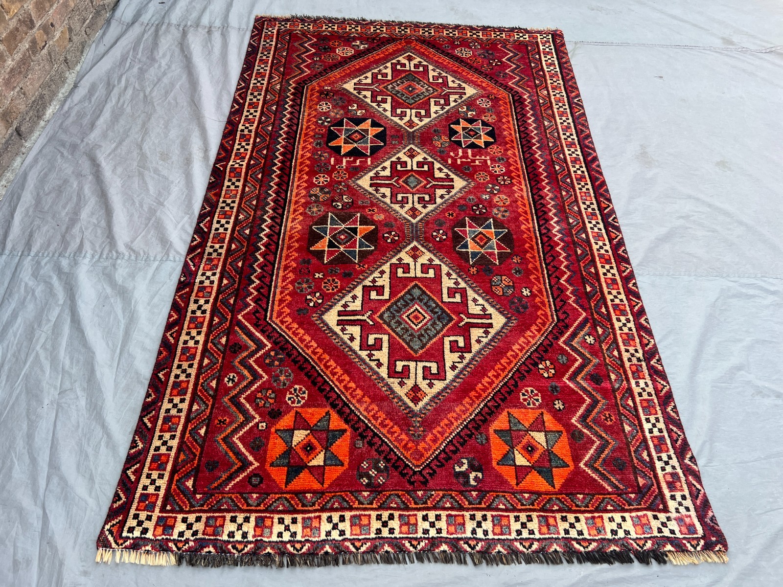 Vintage Turkish-Inspired Rug | 4’9″ x 7’10” Faded Geometric Medallion Area Rug