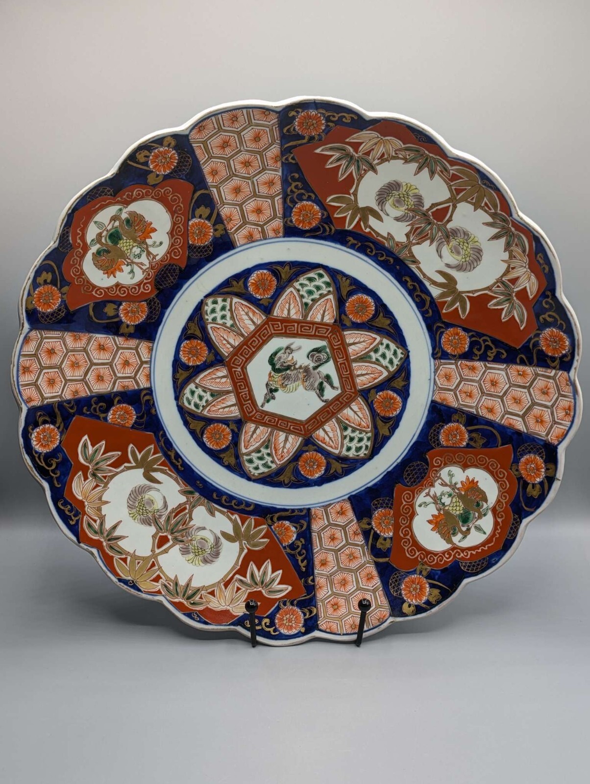Japanese Imari porcelain charger with Kirin and crane motifs, Arita, late Meiji