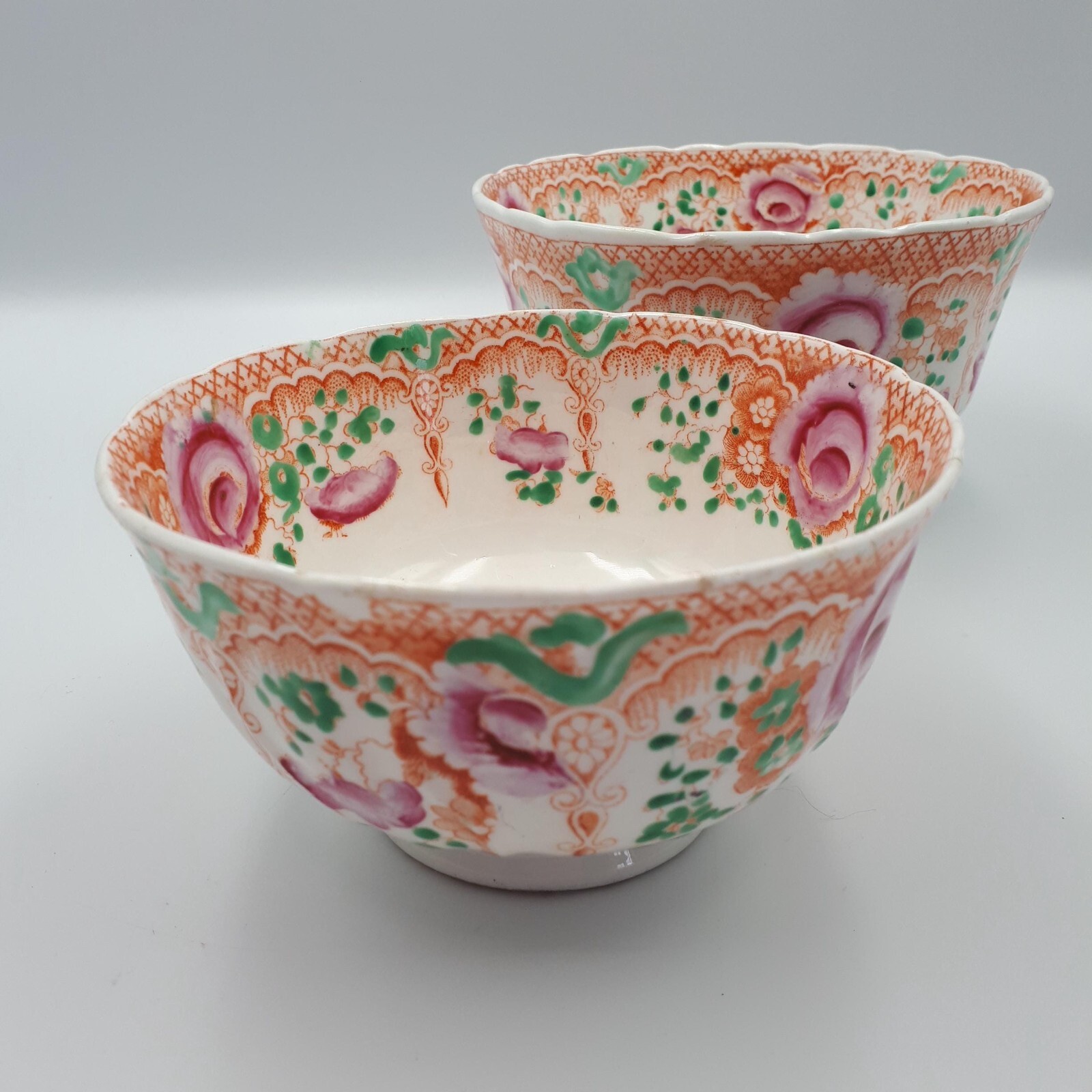 Antique floral bowls footed porcelain with orange pink floral decoration.